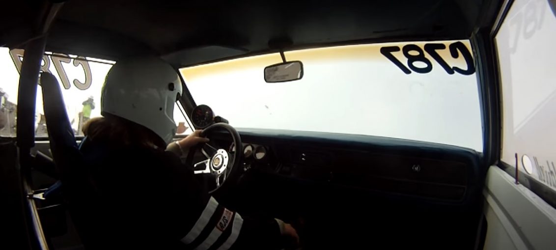 Woman drag racer wheelie