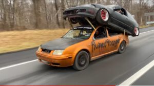 VW Towing a Civic on his Roof