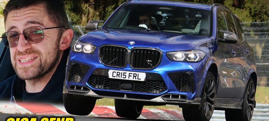 BMW X5 M performance SUV driving at high speed on the Nürburgring Nordschleife during a track lap.