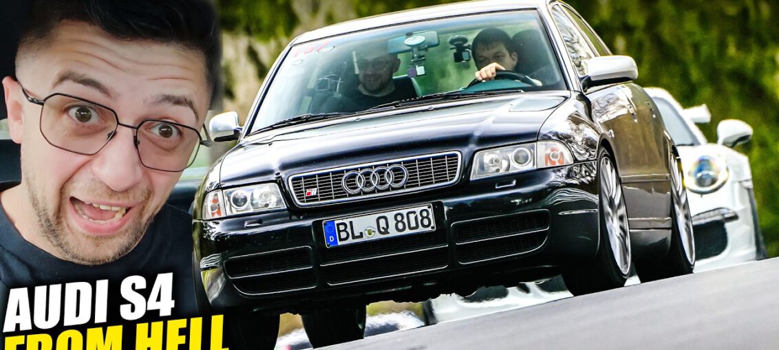 Audi S4 B5 drifting aggressively through a corner at the Nürburgring Nordschleife