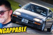 Honda CRX driving on Nürburgring race track during high speed lap showcasing lightweight classic Japanese sports car