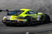 A Mercedes-AMG GT2 race car accelerates down the main straight at Monza Circuit during the GT2 European Series, showcasing its twin-turbo V8 performance.