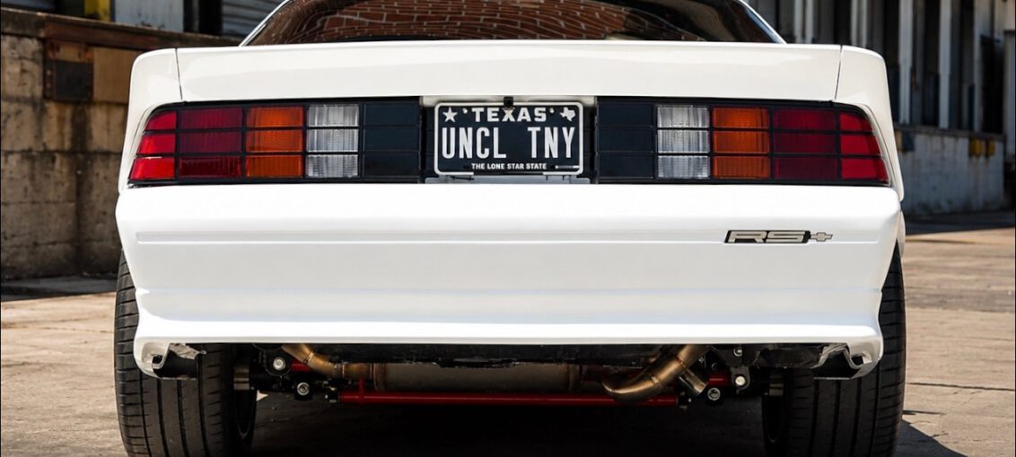 1991 Chevy Camaro restomod with a 525HP LS3 V8 engine driving on the road.