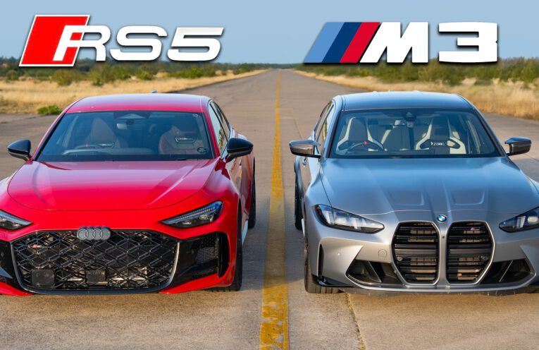 New Audi RS5 and BMW M3 Competition facing each other before a drag race.